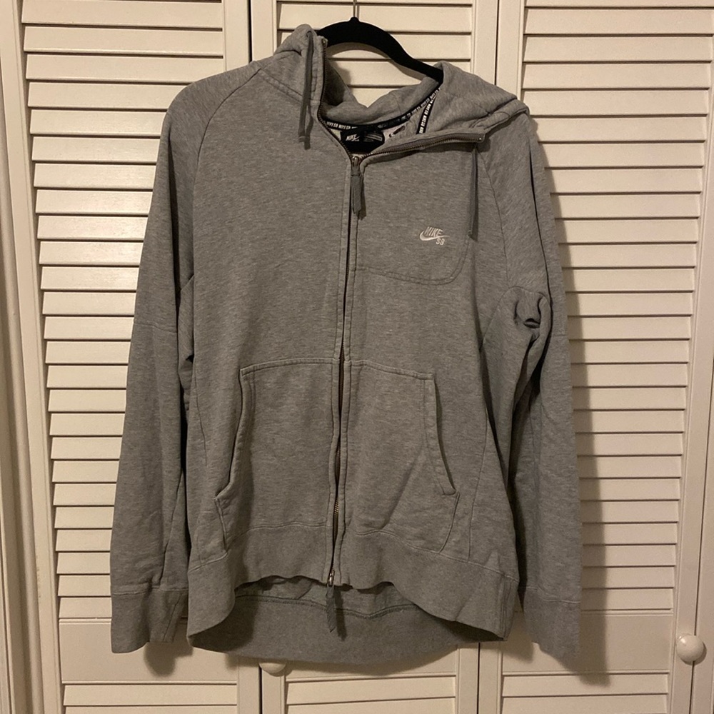 Grey Nike zip up.